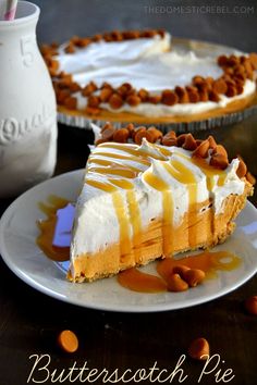 a slice of cheesecake on a white plate with caramel drizzles