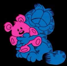 a blue and pink teddy bear sitting on top of another stuffed animal in the dark