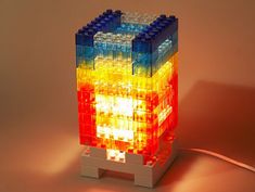 a lamp made out of legos sitting on top of a table