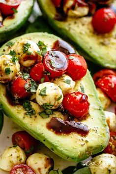 avocado stuffed with tomatoes, mushrooms and other vegetables