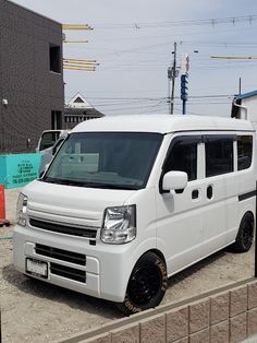 a white van parked on the side of a road