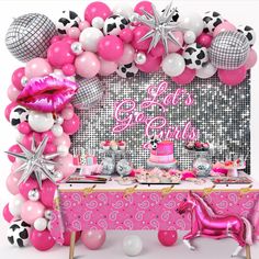 a pink and white birthday party with balloons, confetti, cake and decorations