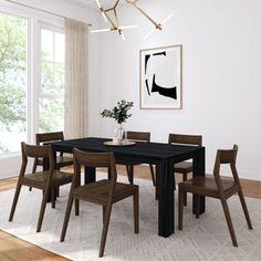 a dining room table with six chairs and a vase on the table in front of it