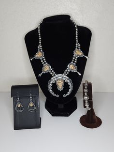 ITEM DESCRIPTION This is a vintage Carolyn Pollack American West jewelry set.  It features a squash blossom necklace with leopard jasper upside-down teardrops.  Also included are a pair of earrings with leopard jasper teardrops and sterling silver borders with rope design.  There is also a memory wire sterling bead bracelet with floral imprints.  Each piece is marked 925.  Also included is the original box with care instruction card and dustbag. See all photos please...they are part of the descr Wire Bead Bracelet, Brown Multi-strand Costume Jewelry, Southwestern Multi-stone Sterling Silver Necklace, Leopard Jasper, Squash Blossom Necklace, Squash Blossom, Rope Design, American West, Memory Wire