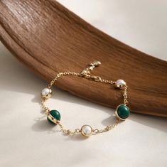 ITEM DETAILS - Bracelet length: 17cm+4cm - Stone size: Malachite 8mm/Freshwater pearl 5.5mm-6mm - Material: 14K gold filled, Natural Malachite, Natural freshwater pearl --------------------------------- SHOW YOUR STYLE - SOPHISTICATION: The rich color Malachite bracelet mix with fresh water pearls delivers an elegant look to you and the ones near you.  - PERFECT GIFT:  Surprise your loved ones with this high quality beauty. It is also ideal for Wedding gifts, Mother's day gifts and Holiday gifts. - YOUR SATISFACTION IS PARAMOUNT TO ME: Please feel free to contact me for any questions or special request regarding this item. I will try to accommodate as much as I can!  --------------------------------- GIFT WRAPPING All products will be carefully packed in an elegant jewelry box. Gift notes Dainty Pearl Bracelet, Malachite Bracelet, Bracelet Christmas, Christmas Bracelet, Freshwater Pearl Bracelet, Fresh Water Pearls, Stackable Bracelets, Bracelet Beaded, Water Pearls