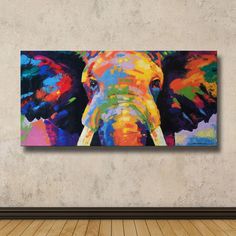 an elephant painted in bright colors on a wall