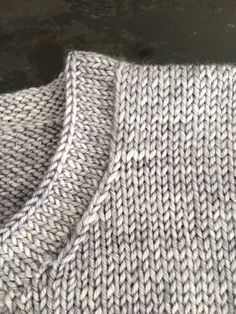 a gray and white knitted fabric