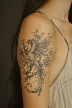 a woman with a bird tattoo on her arm