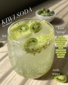 kiwi soda in a glass with slices of kiwi on the rim and ice