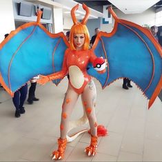 a woman dressed in an orange and blue costume