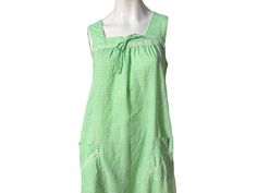 "Vintage green and white check cotton dress, no tags looks to be handmade, has lace trim, 2 front pockets, tie bow at the top. Dress is in great condition, measurements are bust up to 36\" waist 22\" across laid flat hips 24\" across laid flat  length 57\"" Green Cotton Dress For Picnic, Vintage Sleeveless Plaid Cotton Dress, Check Dress, Tie Bow, Top Dress, Green Cotton, Green And White, Cotton Dress, Vintage 70s