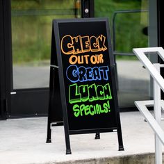 a chalkboard sign that says get out our great lunch specials