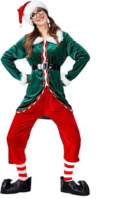 a woman dressed as santa clause posing for the camera with her hands on her hips