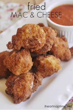 fried mac and cheese on a plate with dipping sauce