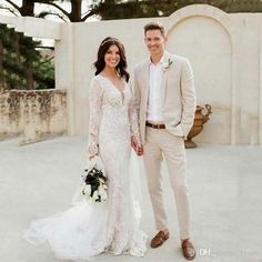 a bride and groom posing for a photo