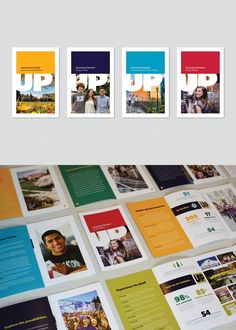 several brochures are displayed on the wall with different colors and designs in them