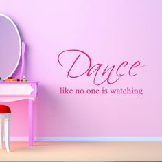 a wall decal with the words dance like no one is watching in front of it