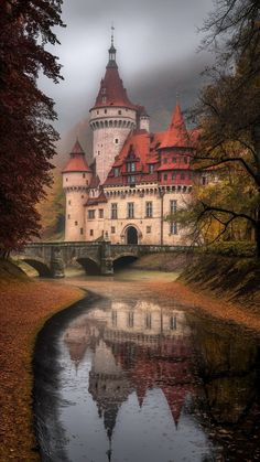 an old castle is reflected in the water