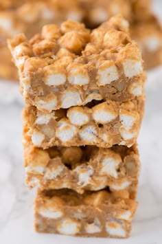 three pieces of food stacked on top of each other with marshmallows in the middle