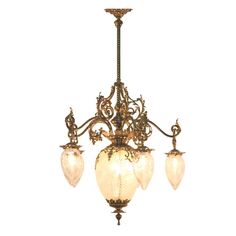 an antique chandelier with three lights hanging from it