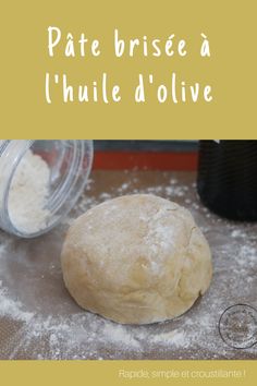 a doughnut sitting on top of a table covered in flour