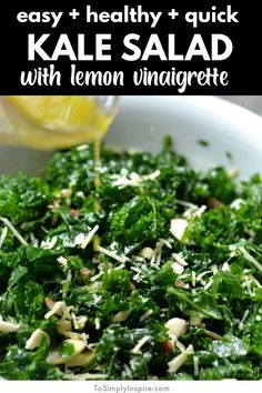 kale salad with lemon vinaigrete in a white bowl on a table