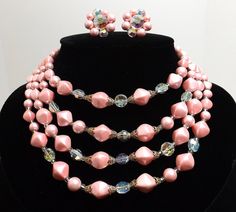 Four Strand Pink Pearl and Aurora Borealis Necklace by KatsCache Pink Round Beads Jewelry For Valentine's Day, Pink Multi-strand Jewelry Gift, Pink Multi-strand Jewelry For Gifts, Pink Multi-strand Jewelry For Party, Adjustable Multi-strand Pink Jewelry, Vintage Beaded Jewelry For Valentine's Day, Vintage Pink Beaded Jewelry, Pink Pearl Jewelry For Party, Pink Vintage Beaded Jewelry