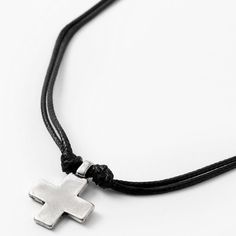 Proudly wear this symbol of your faith! The rustic silver cross pendant hangs from a faux leather double-cord necklace that's knotted to keep the pendant in place. Length: 18" + 3" extender Closure: Lobster clasp Material: Metal, Faux leather - Claire's Rustic Silver Cross Pendant 18" Black Cord Necklace Adjustable Nickel-free Crucifix Necklace, Adjustable Spiritual Cross Pendant Necklace, Adjustable Cross Pendant Jewelry, Spiritual Cross Jewelry With Adjustable Cord, Adjustable Cross Jewelry With Cord, Adjustable Cross Pendant Necklace, Minimalist Adjustable Cross Pendant Necklace, Adjustable Cross Jewelry With Adjustable Cord, Adjustable Cross-shaped Jewelry With Cord