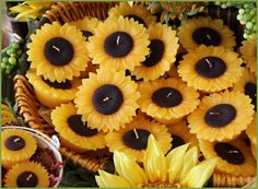 sunflowers and candles are on display in a basket