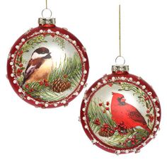 two christmas ornaments with birds on them