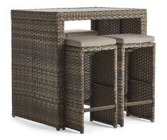 three brown wicker bar stools with cushioned seats on each side and an open storage unit in the middle