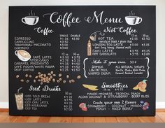 a blackboard menu with coffee and other drinks on it, in front of a white wall