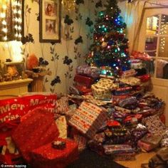 a christmas tree is surrounded by presents