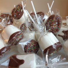 chocolate covered marshmallows are wrapped in cellophane and have sprinkles