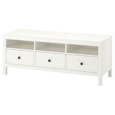 a white tv stand with drawers on it