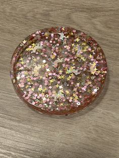 Handmade resin coaster, catch all tray, jewelry tray  Made with high quality non yellowing resin  Item features pink and gold halographic glitter and stars and unicorns  item is 3.125in X 3.125in X 0.375in Background can be custom color other then clear (please message with purchase requested color if wanted)  Makes a great birthday gift, valentines gift, kids gift, house warming gift, or gift for yourself  Item is made to order Catch All Tray, Unicorn And Glitter, Ring Tray, Resin Coaster, Jewelry Tray, Great Birthday Gifts, Trinket Tray, Pink And Gold, Custom Color