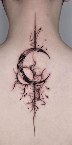 the back of a woman's neck with an abstract tattoo design on her left side