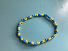 Blue and gold bracelet Blue Beaded Bangle Bracelets, Blue Round Gold Bracelet For Gift, Light Blue Bangle Bracelets As A Gift, Blue Stretch Bangle Bracelet As Gift, Blue Bangle Stretch Bracelet As Gift, Casual Blue Bangle Bracelets, Casual Blue Bangle Bracelet, Casual Light Blue Bracelet Jewelry, Blue And Gold