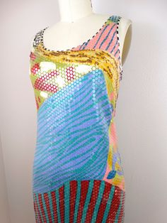 "This is such a rare dress from Missoni. It's fully embellished with clear sequins on silk with a funky abstract design. It's in excellent condition! Measurements: (note, there's a little stretch in the material) Bust - 32-36\" Waist - 30-34\" Hips - 36-40\" Total Length - 39\" This dress comes from a pet-free and smoke-free home. If you would like more info or have any questions, please don't hesitate to ask!" Sleeveless Sequin Dress With Rhinestones For Summer, Hand Embellished Sleeveless Summer Dress, Sleeveless Summer Dress With Mirror Work, Summer Party Dress Hand Embellished, Fitted Multicolor Sequin Fabric For Summer, Embellished Multicolor Sequin Dress For Summer, Embellished Multicolor Sequin Summer Dress, Multicolor Embellished Sequin Dress For Summer, Multicolor Embellished Sequin Summer Dress