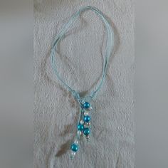 This Is A Handmade, Freshwater Pearl And Handcrafted Leather Cord Necklace. I Bought The Necklace Brand New But It Has Never Been Worn. The Necklace Has Light Blue, White And Gold Pearls On Baby Blue Leather. This Can Be Worn 2 Different Ways. The Necklace Is 9"- 16 1/2" Around The Neck And 12"- 21" Long. I Will Combine Shipping. Thanks For Looking! Handmade Adjustable Light Blue Necklace, Adjustable Handmade Light Blue Necklace, Pink Shell Necklace, Black Pearl Jewelry, Amethyst Stone Necklace, Silk Cord Necklace, Fish Pendant Necklace, The Black Pearl, Leather Cord Necklace