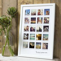 a vase filled with flowers next to a framed photo