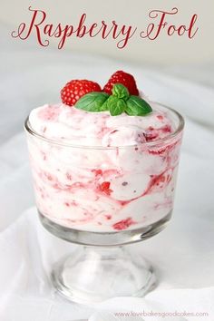 raspberry fool in a small glass dish with strawberries on top and the words,