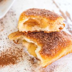 two pastries with powdered sugar on them