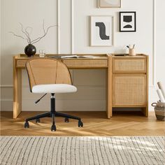 an office chair sitting in front of a wooden desk