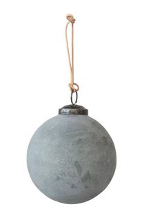 a gray ball ornament hanging from a rope