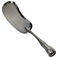 a silver spoon with an ornate design on the bottom and handle is shown in front of a white background