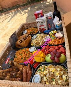 a basket filled with lots of food sitting on top of a table