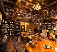 a living room filled with lots of furniture and bookshelves