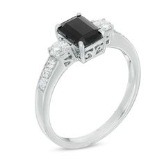 Bold and dramatic, this elegant fashion ring is just her style. Crafted in sleek sterling silver, this ring features a stunning 7.0 x 5.0mm emerald-cut black sapphire center stone. Smaller round white sapphires flank this eye-catching gem, while white sapphire accents line the ring's shank. A colorful contrast with a sophisticated design, this ring is finished with a bright polish. This ring is available in select sizes only. Sterling silver rings cannot be resized after purchase. Elegant Sapphire Ring With Square Cut And Prong Setting, Modern Emerald Cut Emerald Ring With Accent Stones, Elegant Solitaire Sapphire Ring With Emerald Cut, Modern Emerald Cut Sapphire Ring With Accent Stones, Elegant Emerald Cut Sapphire Ring For Formal Occasions, Elegant Square Cut Sapphire Ring With Prong Setting, Promise Ring Sapphire With Polished Finish Emerald Cut, Promise Ring: Sapphire With Polished Finish, Emerald Cut, Timeless Silver Emerald Cut Sapphire Ring