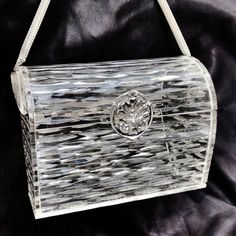 1940s Vintage Wilardy Clear Carved Lucite Box Handbag W/ Silver Clasp & Mesh Handle. Stunning Clear Dimensional Lucite Handbag- Beautiful Silver Flower Clasp, 2 Silver Mesh Handles, Which Has A Bend At The End Handle On One Side. Marked Wilardy Inside On Silver Trim Make A Statement Wearing This Chic Unique Handbag! Measures Approximately 4.5" X 5.75" X 4". There Are A Couple Hairline Cracks I Tried To Photograph, But I Couldn't Get Them B/C They Are So Hard To See. Being Sold Online For $1695! Lucite Bags Vintage Handbags, Unique Handbag, Silver Flowers, Vintage Bags, Just Amazing, Selling Online, I Tried, Bend, The End